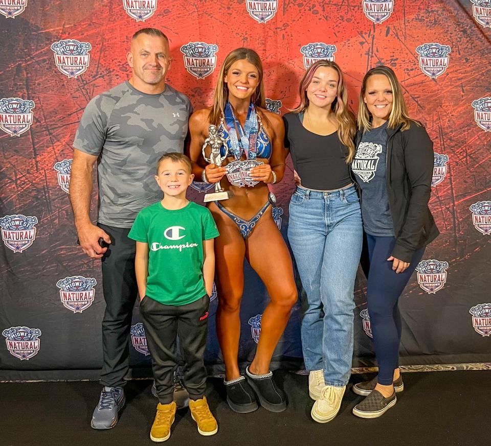 Bodybuilder Ashley Cadwell, a 2022 Webster Area High School graduate, is pictured with her family after winning her division recently in a competition at Sioux Falls. Pictured from left are dad Scott, brother Cash, Ashley sister Gracie and mom Becky.