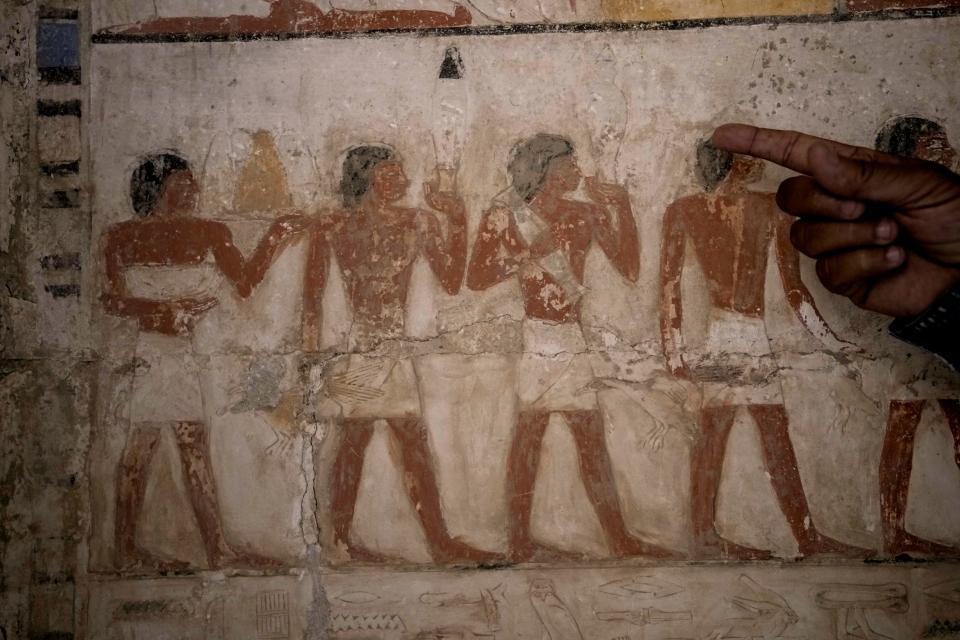 A colored painting showing offering sacrifices at a recently uncovered tomb that was said to belong to a top official of the fifth Dynasty named Ne Hesut Ba on Saturday, May 27, 2023.