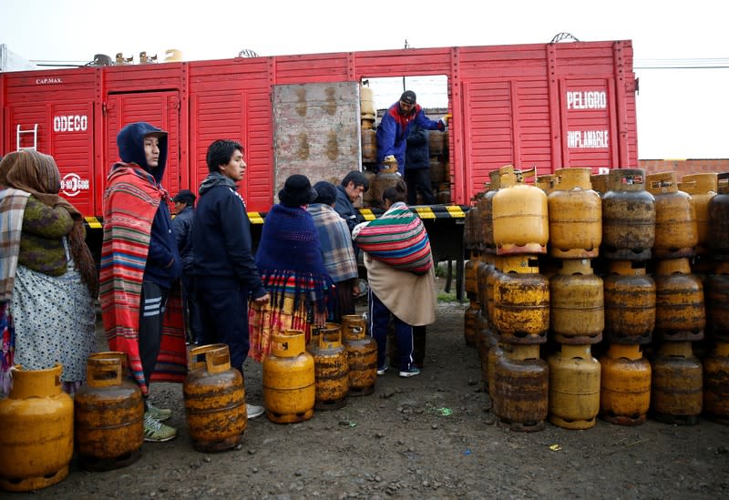 People line up to get a gas cylinder near petrol plant of Senkata, that normalizes fuel distribution in El Alto outskirts of La Paz