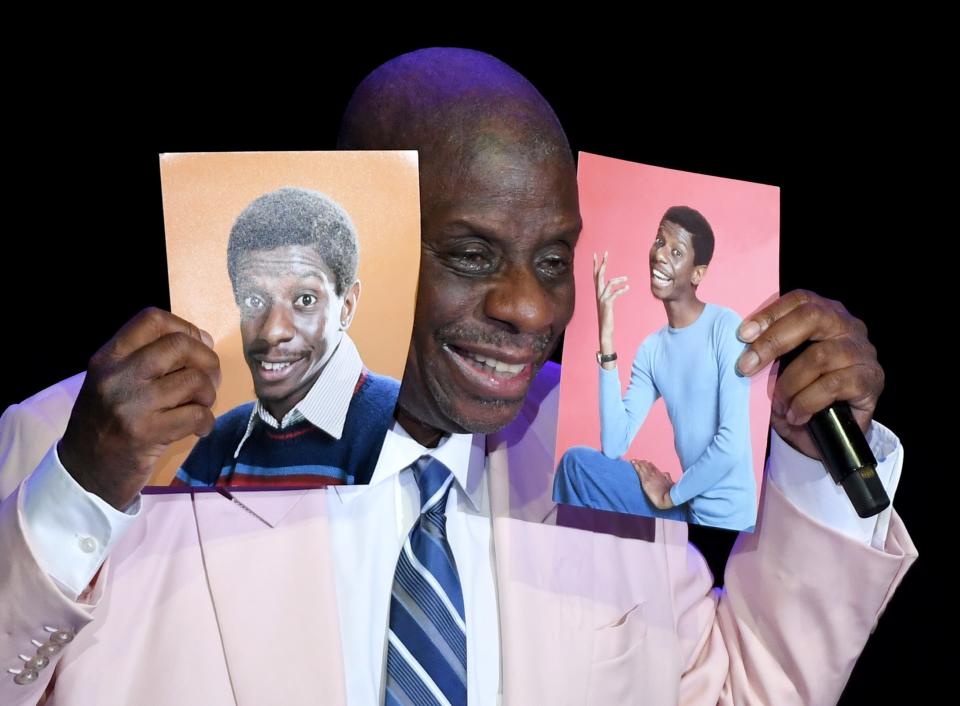 Actor/comedian and host Jimmie Walker holds up photos of his younger self as he performs his stand-up comedy routine before introducing Deon Cole at The Orleans Showroom at The Orleans Hotel & Casino on August 24, 2019 in Las Vegas, Nevada.
