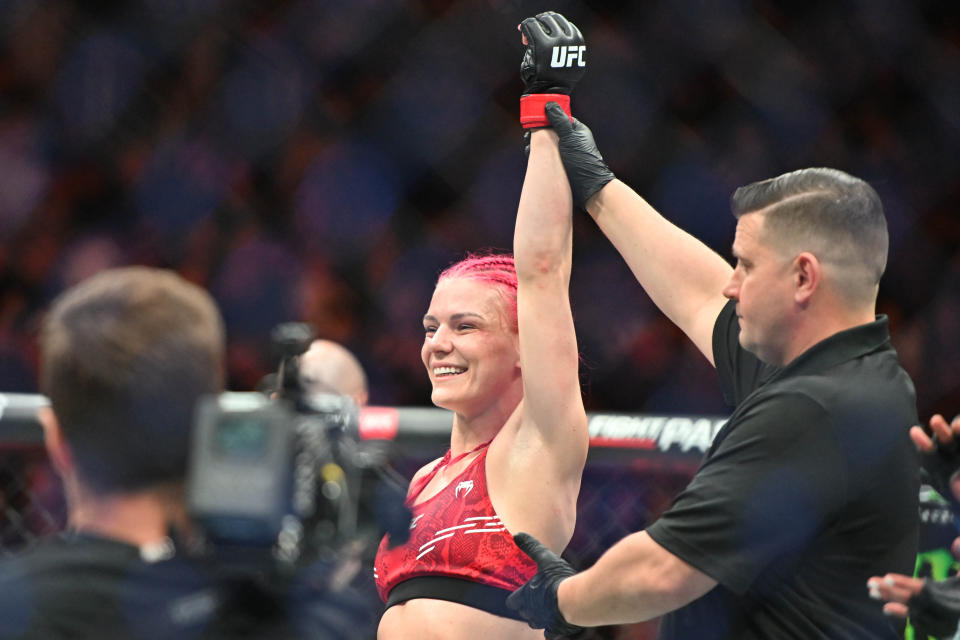 Jan 20, 2024; Toronto, Canada, USA; Gillian Robertson (red glove) celebrates defeating Polyana Viana (blue gloves) during UFC 297 at ScotiaBank Arena. Mandatory Credit: Dan Hamilton-USA TODAY Sports