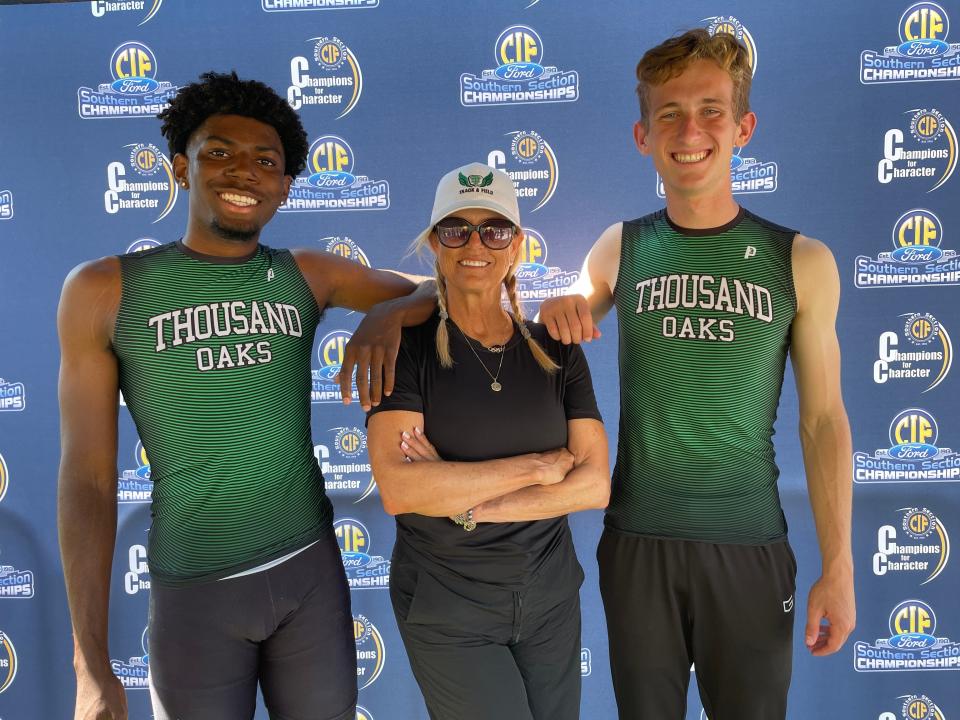 Thousand Oaks senior hurdlers Pyrce Edwards and Jeremy Frank pose with coach Marlene Wilcox after both qualified for the CIF State track championships for the first time Saturday at Moorpark High