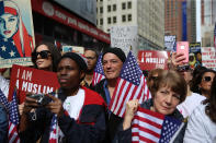 <p>Participants hold signs and flags at the “I am a Muslim too” rally at Times Square in New York City on Feb. 19, 2017. (Gordon Donovan/Yahoo News) </p>