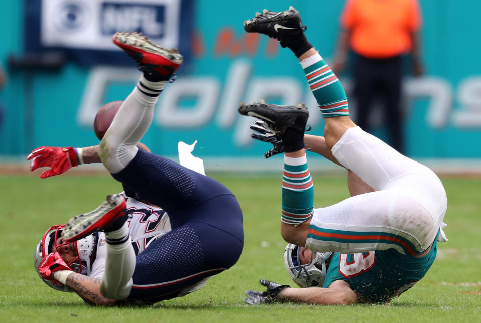 <p>Miami Gardens, FL 12-9-18: Patriots DB Patrick Chung (left) and Dolphins WR Danny Amendola (right) strike similar poses as an incomplete pass eluded both of them.The New England Patriots visited the Miami Dolphins in a regular season NFL football game at Hard Rock Stadium. (Jim Davis/Globe Staff) </p>