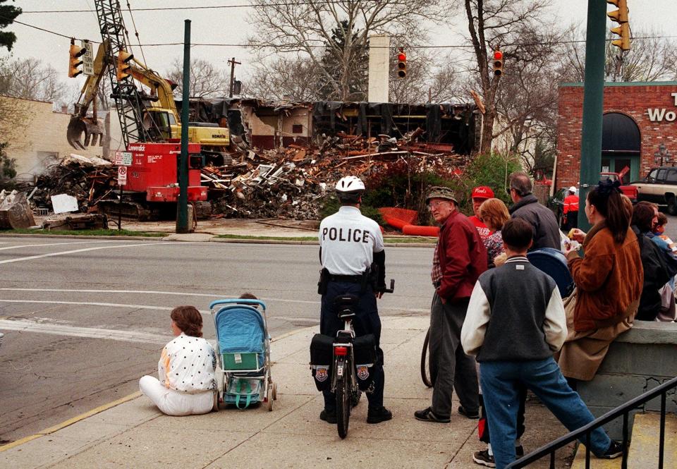 A crowd gathers at Main and Cassingham in Bexley in 1997 to watch the much-delayed demolition of the Bexley Art Theatre, 2484 E. Main St.