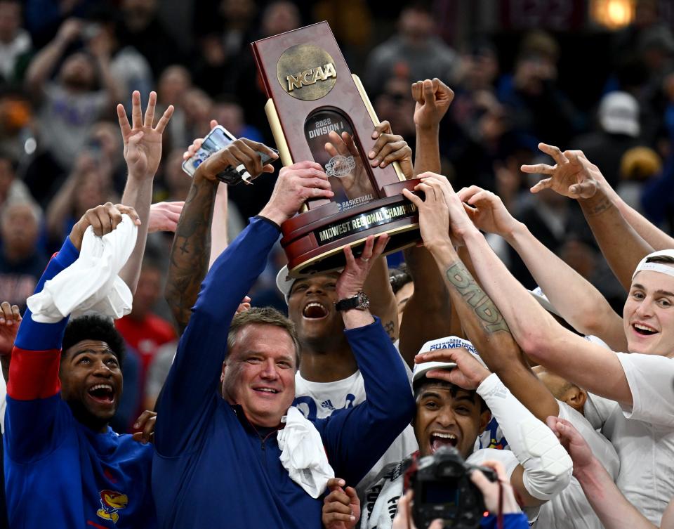 Kansas coach Bill Self celebrates with his team after advancing to the Final Four by defeating Miami in the Midwest regional final.