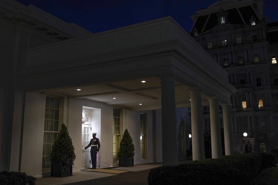 A Marine stands outside the entrance to the West Wing of the White House, signifying President Donald Trump is in the Oval Office, Thursday, Jan. 7, 2021, in Washington. (AP Photo/Patrick Semansky)