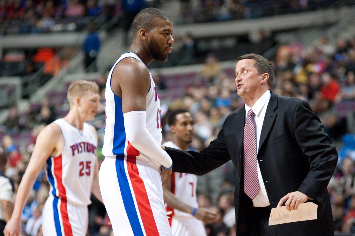 Feb 22, 2014; Auburn Hills, MI, USA; Detroit Pistons head coach John Loyer talks to power forward Greg Monroe (10) during the first quarter against the Dallas Mavericks at The Palace of Auburn Hills. Mandatory Credit: Tim Fuller-USA TODAY Sports