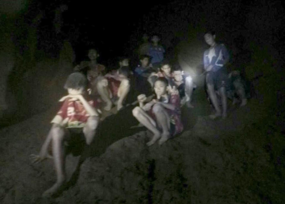 <em>The 12 young footballers trapped in a cave in Thailand have been invited to the World Cup final (Picture: Rex)</em>