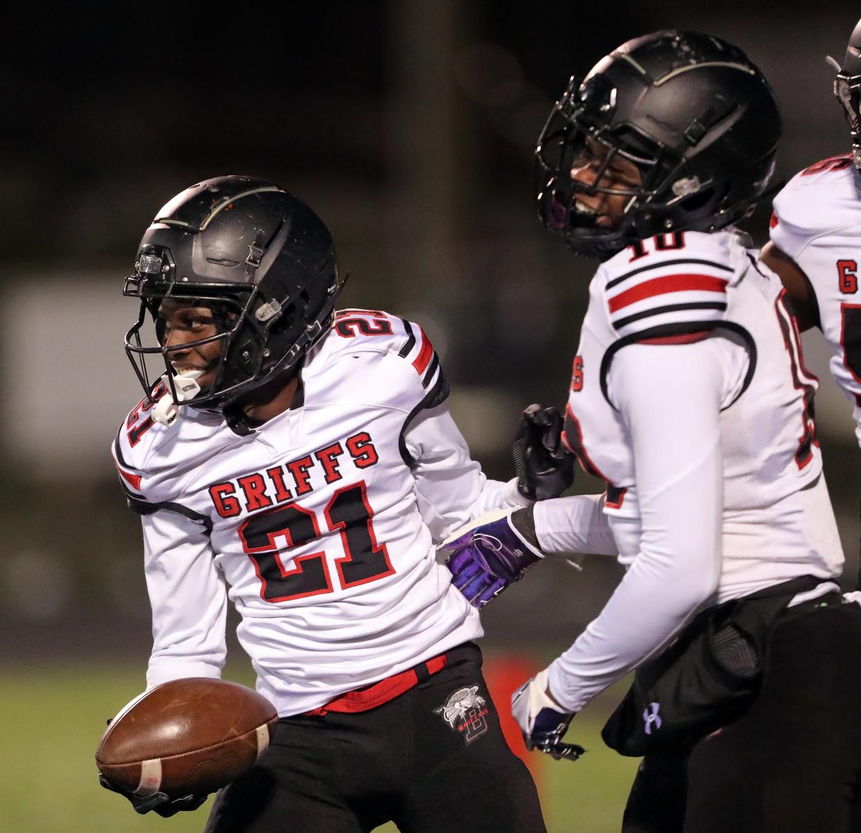 Buchtel running back Wiley Chairs, left, celebrates his rushing touchdown with tight end Demetrice Coates, right, during the first half of a high school football game against the Firestone Falcons, Friday, Oct. 21, 2022, in Akron, Ohio.