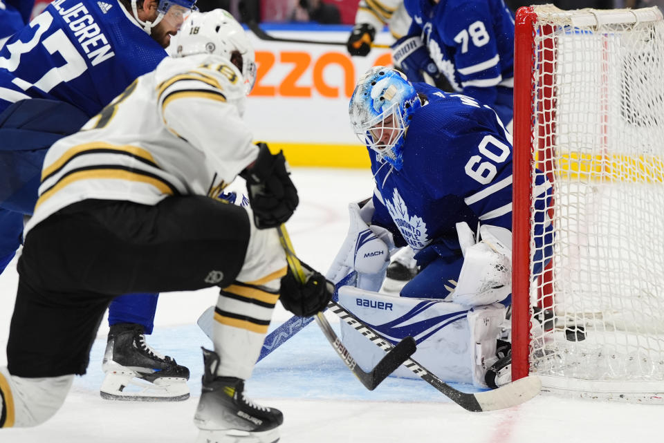 Boston Bruins center Pavel Zacha scores on Toronto Maple Leafs goaltender Joseph Woll (60) during the third period of an NHL hockey game in Toronto, Monday, March 4, 2024. (Frank Gunn/The Canadian Press via AP)