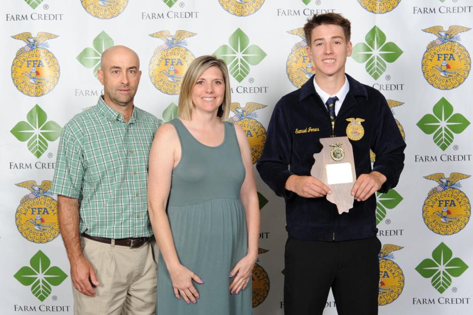 Sam Jones, right, with parents Chad and Ginny Jones, was selected as the State FFA Proficiency winner in Nursery Operations at the 94th annual Illinois State FFA Convention.