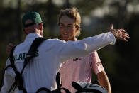 Will Zalatoris hugs his caddie Ryan Goble on the 18th hole during the final round of the Masters golf tournament on Sunday, April 11, 2021, in Augusta, Ga. (AP Photo/David J. Phillip)