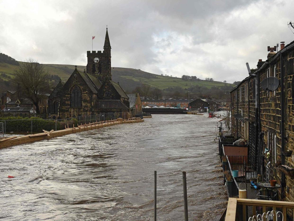 New flood defences in West Yorkshire failed to prevent a river bursting its banks at the weekend: AFP/Getty