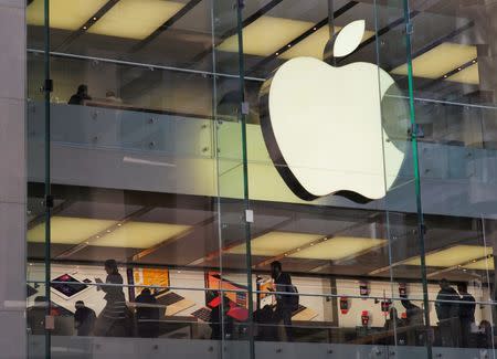 Customers and employees are shown through Apple's Australian flagship store in Sydney, September 7, 2016. REUTERS/Jason Reed