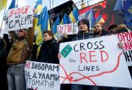 People take part in a rally ahead of the so-called "Normandy" format summit, in Kiev