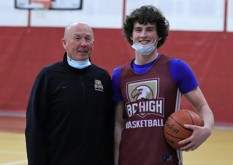 Mike Loughnane, right, stands with father and coach, Bill Loughnane, at practice on Wednesday, Jan. 12, 2022, the day after scoring his 1,000th career point against Xaverian.