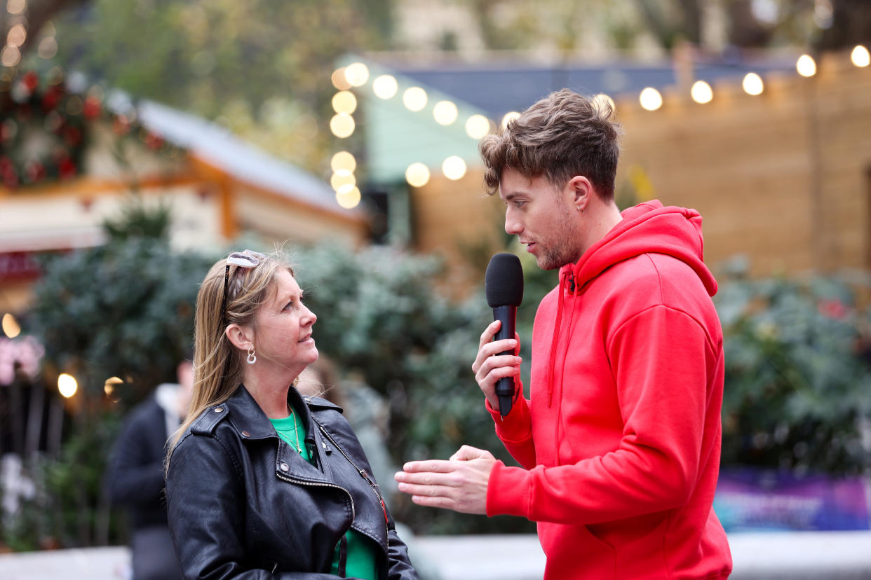 Roman Kemp talking to member of the public on the street about how they respond when asked how they are. (SWNS)