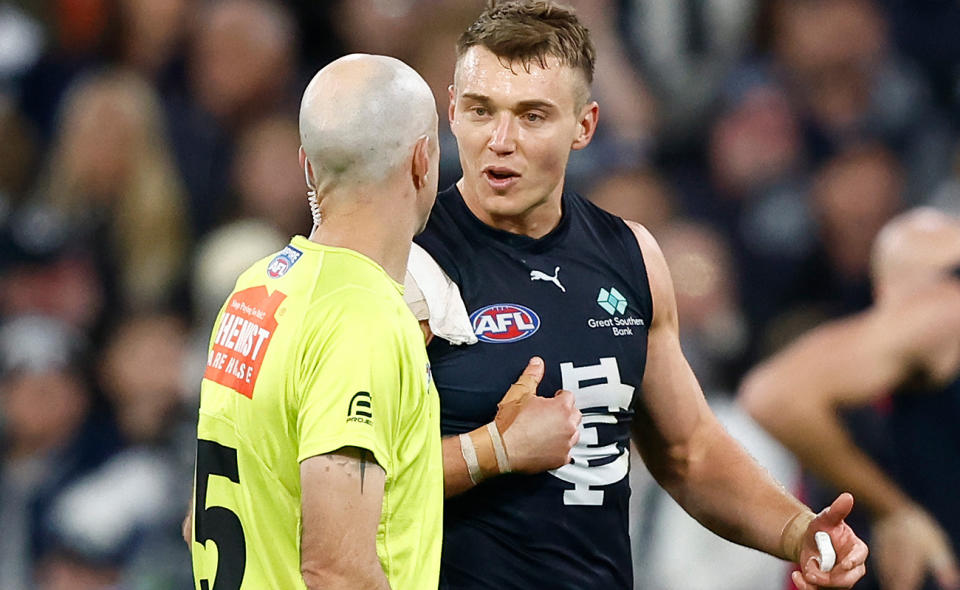 Patrick Cripps, pictured here speaking to an umpire during an AFL game.