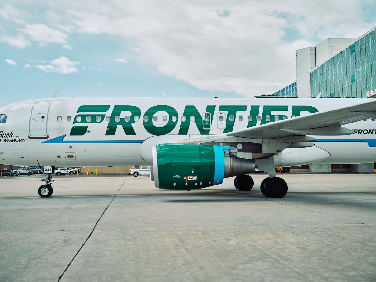 A Frontier Airlines plane is seen at Denver International Airport on June 14, 2022.