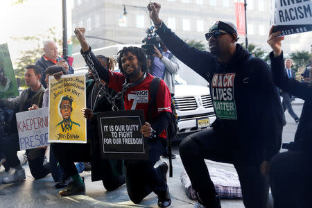 Demonstrators rally outside the location of the annual NFL owners meeting in New York City, NY, U.S. October 17, 2017. REUTERS/Shannon Stapleton