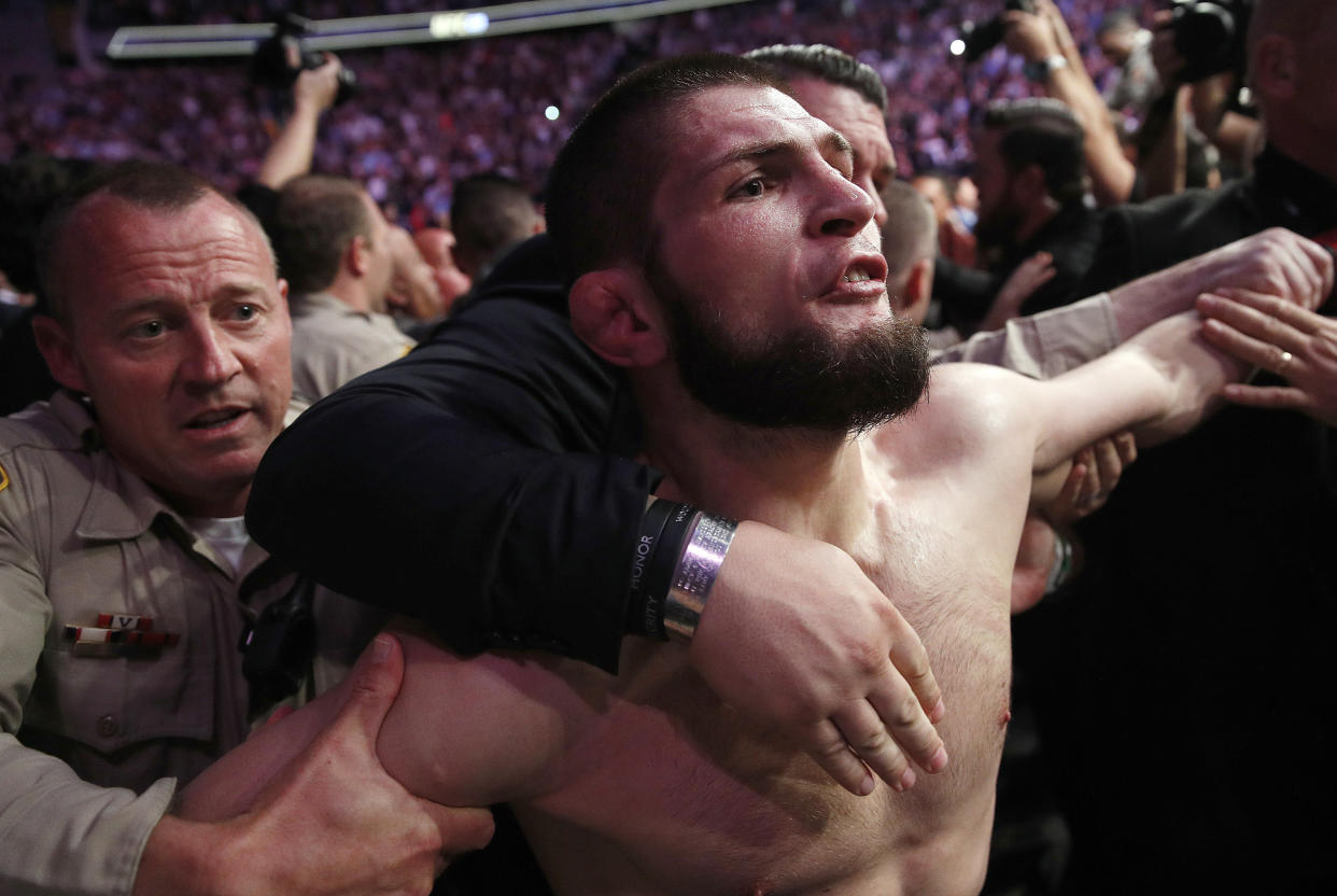 Khabib Nurmagomedov had a harsh response to Conor McGregor's deleted tweet that insulted his wife's choice of dress on their wedding day. (AP Photo/John Locher, File)