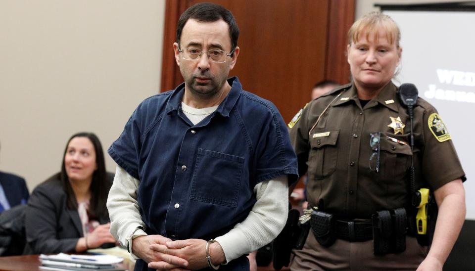 Larry Nassar&nbsp;is escorted by a court officer during his&nbsp;sentencing hearing in Lansing, Michigan, on Jan. 17, 2018. (Photo: Brendan McDermid / Reuters)