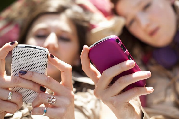 Teens often communicate via text using phrases and emojis with hidden meanings. (Photo: Getty Images)