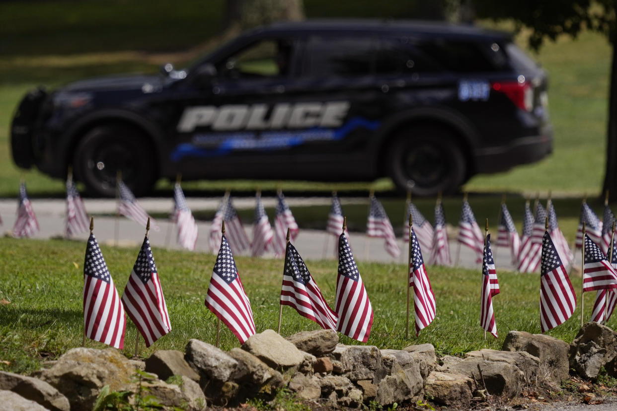 FILE - Police watch over the site of a visitation for Corey Comperatore at Laube Hall, July 18, 2024, in Freeport, Pa. Comperatore was killed at rally for former President Donald Trump Saturday. (AP Photo/Eric Gay, File)