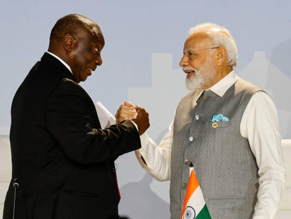 South African president Cyril Ramaphosa and prime minister of India Narendra Modi shake hands during the 2023 Brics Summit at the Sandton Convention Centre in Johannesburg on 24 August 2023 (AFP via Getty Images)