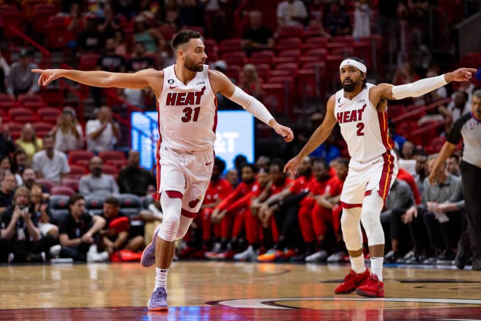 Miami Heat forward Max Strus (31) and point guard Gabe Vincent (2) motion to teammates during the first half of an NBA play-in tournament game against the Chicago Bulls at Kaseya Center in Downtown Miami, Florida, on Friday, April 14, 2023.