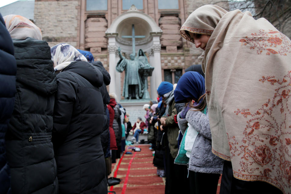 Muslim women pray during a protest against President Donald Trump's travel ban on Jan. 29, 2017.