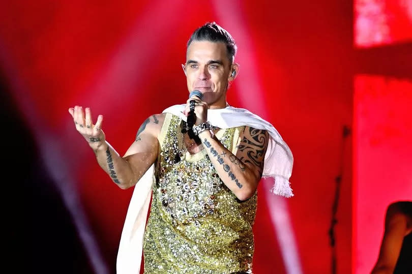 SANDRINGHAM, NORFOLK - AUGUST 26: Robbie Williams performs on stage during Heritage Live 2023 at Royal Sandringham Estate on August 26, 2023 in Sandringham, Norfolk. (Photo by Gus Stewart/Redferns)