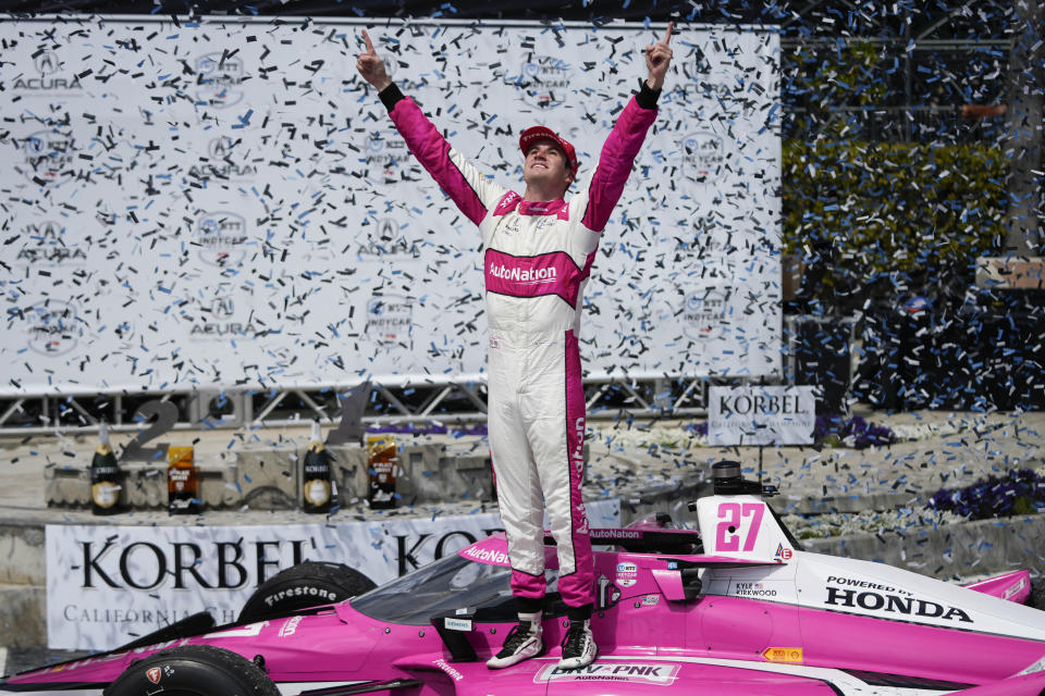 Kyle Kirkwood celebrates during the victory ceremony after winning the IndyCar Grand Prix of Long Beach auto race, Sunday, April 16, 2023, in Long Beach, Calif. (AP Photo/Jae C. Hong)