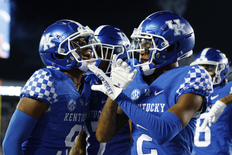 Kentucky wide receiver Tayvion Robinson (9) celebrates with wide receiver Barion Brown (2) after scoring a touchdown against Northern Illinois during the second half of an NCAA college football game in Lexington, Ky., Saturday, Sept. 24, 2022. (AP Photo/Michael Clubb)