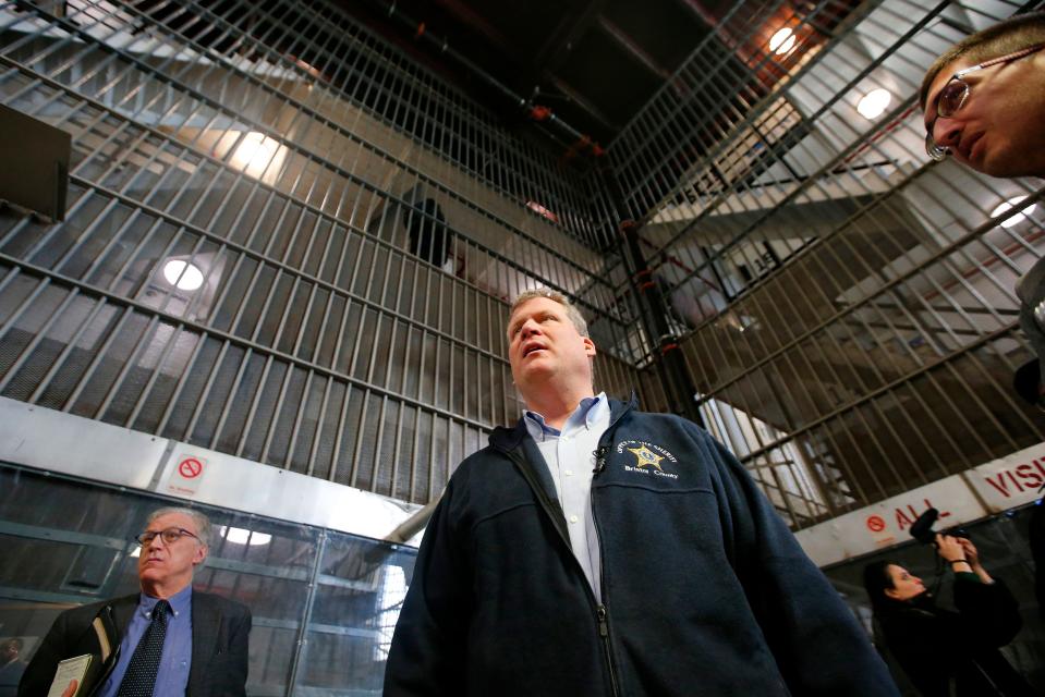 Bristol County Sheriff Paul Heroux gives media and state representatives a tour of the Ash Street jail in New Bedford which he plans on closing.