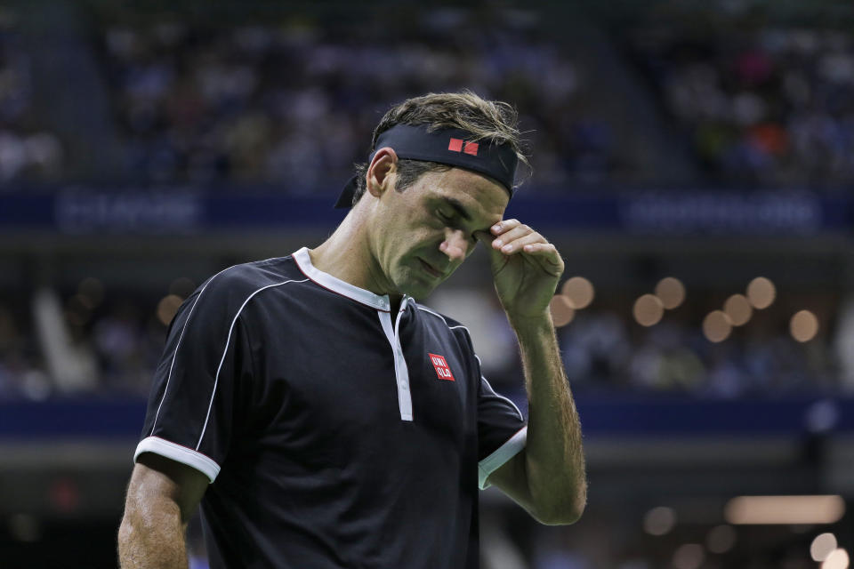 Roger Federer, of Switzerland, reacts during a match against Grigor Dimitrov, of Bulgaria, during the quarterfinals of the U.S. Open tennis tournament Tuesday, Sept. 3, 2019, in New York. (AP Photo/Seth Wenig)