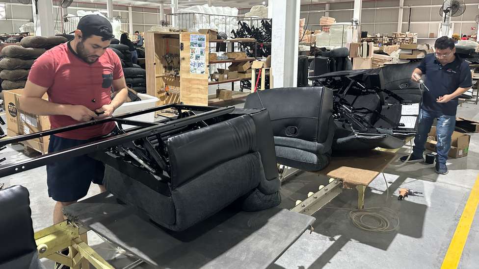 Mexican workers building sofas at Man Wah's factory in Monterrey