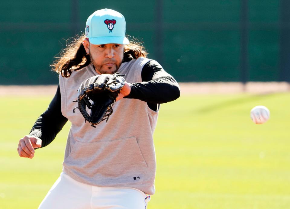 Arizona Diamondbacks infielder Eugenio Suarez fields a ground ball during spring training workouts at Salt River Fields at Talking Stick in Scottsdale on Feb. 22, 2024.