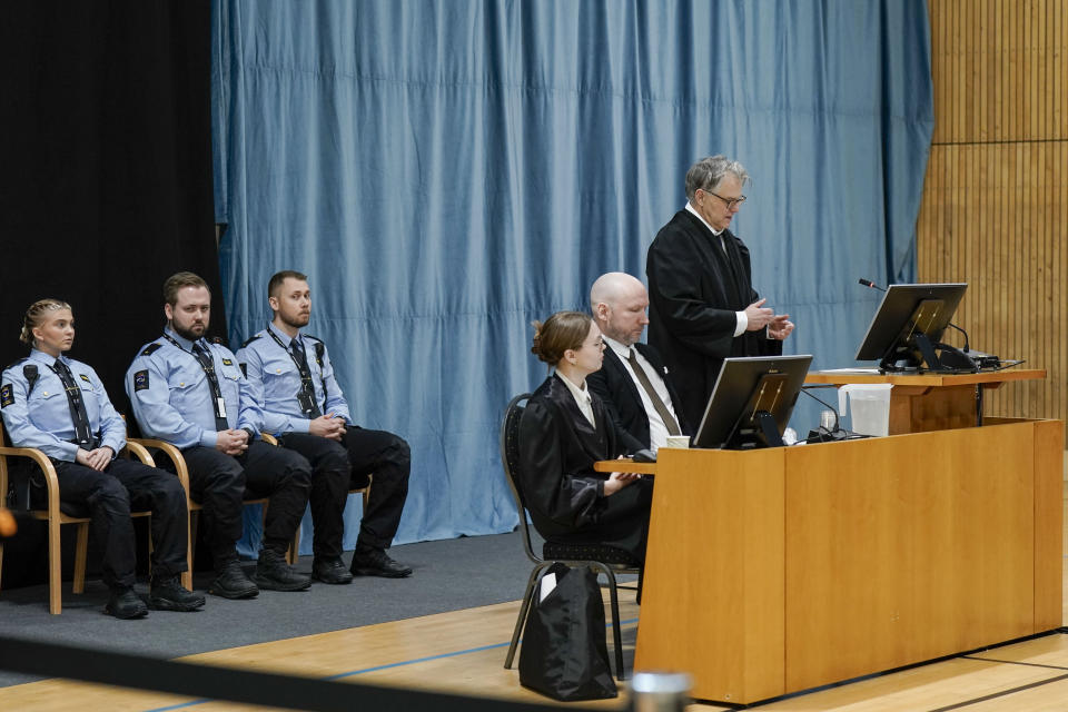 Anders Behring Breivik sits between his representatives, lawyer Øystein Storrvik, right and associate attorney Marte Lindholm, as the Oslo district court conducts his case in a gymnasium at Ringerike prison, in Ringerike, Norway, Monday, Jan. 8, 2024. Breivik, who slayed 77 people in an anti-Islamic bomb and gun rampage in 2011, appeared in court on Monday in a bid to sue the Norwegian state for breaching his human rights. Norway’s worst peacetime killer says his solitary confinement since being jailed in 2012 amounts to inhumane treatment under the European Convention of Human Rights. (Cornelius Poppe/NTB Scanpix via AP)