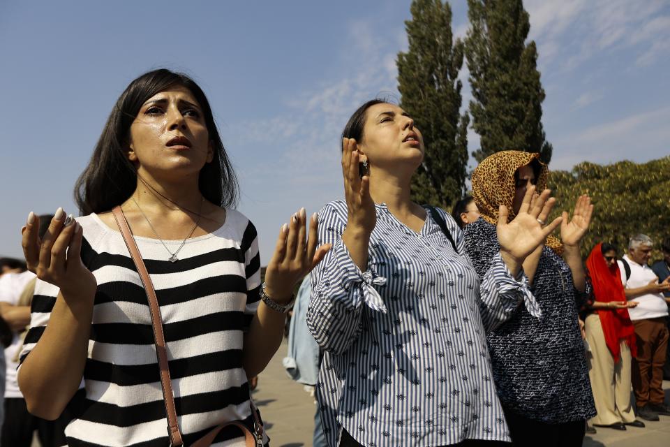 Armenian parishioners attend a national day of prayer for Artsakh (Nagorno-Karabakh) leading by Armenian Catholicos Karekin II at the Armenian Apostolic Cathedral in Etchmiadzin, the seat of the Oriental Orthodox church outside in Yerevan, Armenia, Sunday, Oct. 1, 2023. Armenia's government says an ethnic Armenian exodus has nearly emptied Nagorno-Karabakh of residents since Azerbaijan attacked and ordered the breakaway region's militants to disarm. (AP Photo/Vasily Krestyaninov)