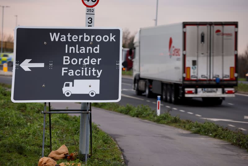 FILE PHOTO: A direction sign is seen for the Waterbrook Inland Border Facility, a temporary customs clearance centre set up in a truck stop in Ashford