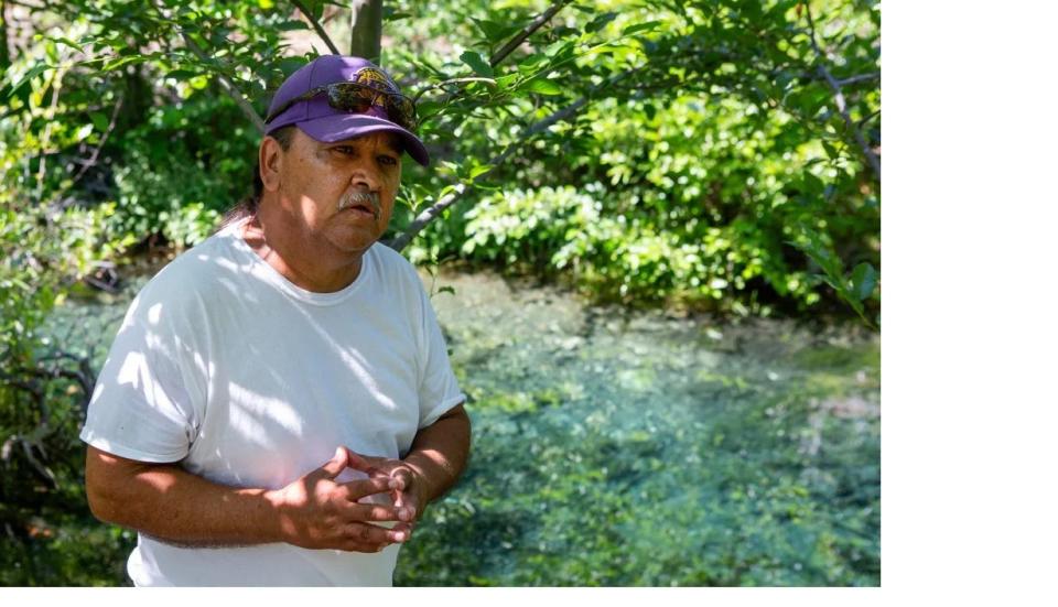 Mike Polmateer, a fisheries field supervisor and member of the Karuk tribe, at a pond built as a refuge for coho.