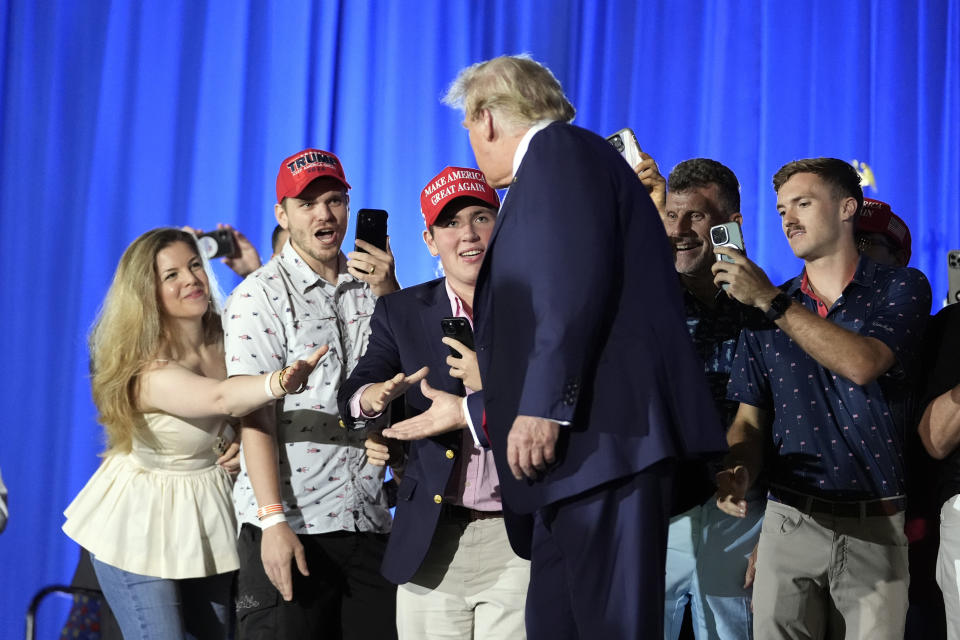 Republican presidential candidate former President Donald Trump greets supporters as he arrives to speak at his birthday celebration, hosted by Club 47, in West Palm Beach, Fla., Friday, June 14, 2024. (AP Photo/Gerald Herbert)