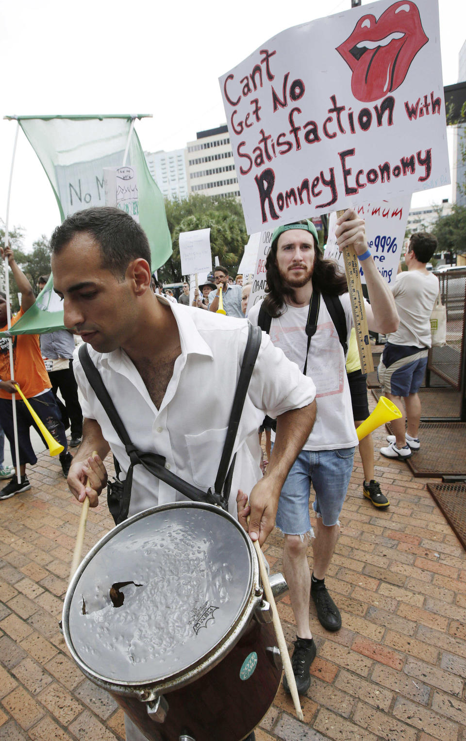 Ganzalo Valdes, of Tampa, Fla., marches with demonstrators in Tampa, Fla., Sunday, Aug. 26, 2012. Hundreds of protestors gathered in Gas Light Park in downtown Tampa to march in demonstration against the Republican National Convention. (AP Photo/Dave Martin)