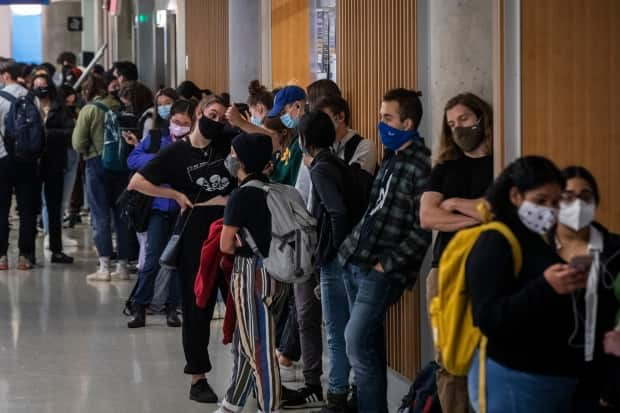 Students wait in line to cast their ballot at a polling station at the University of British Columbia in Vancouver on Monday.  (Ben Nelms/CBC - image credit)