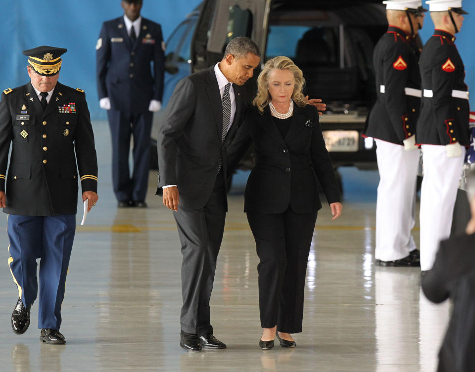 <p>President Barack Obama and U.S. Secretary of State Hillary Clinton walk away from the podium during the Transfer of Remains Ceremony for the return of Ambassador Christopher Stevens and three other Libyan embassy employees at Joint Base Andrews September 14. 2012 in Joint Base Andrews, Maryland. Stevens and the three other embassy employees were killed when the consulate in Libya was attacked September 11. (Molly Riley-Pool/Getty Images) </p>