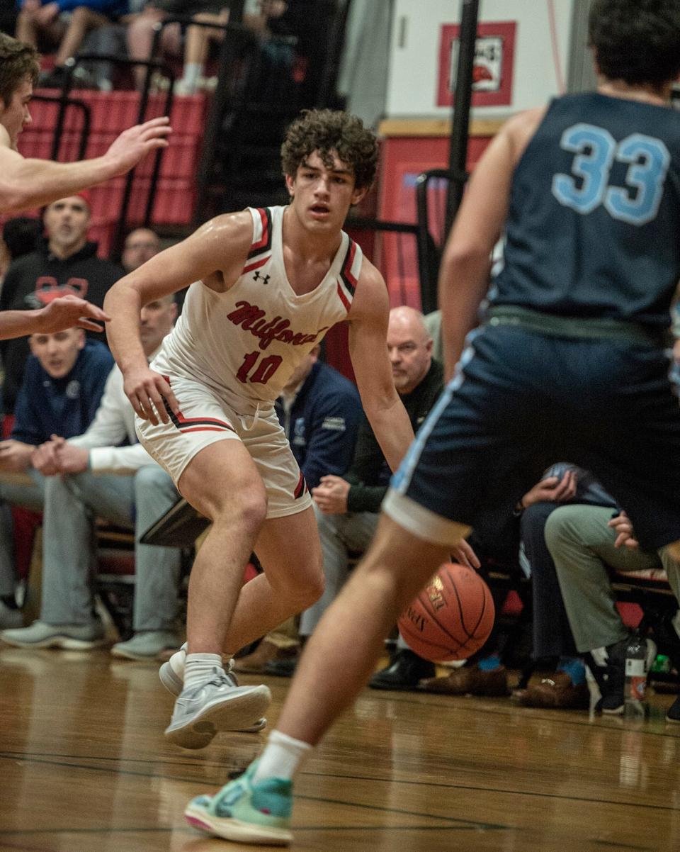 Milford High School sophomore Andrew Rivera sets up a play against Franklin, Feb. 17, 2023.