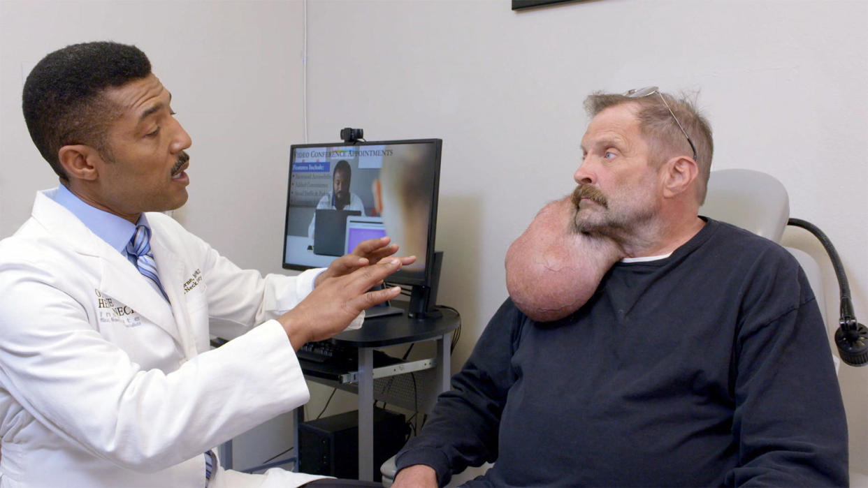 Dr. Ryan F. Osborne with a patient. (TLC)