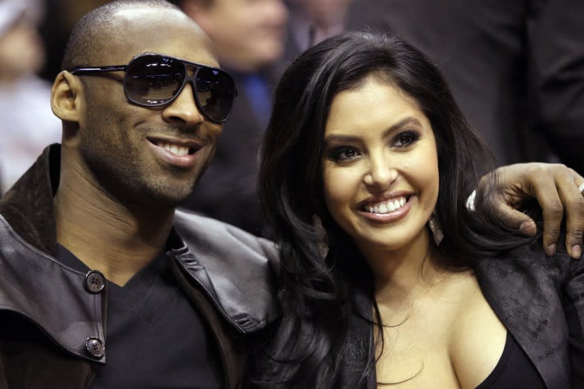 FILE - In this Feb. 13, 2010, file photo, Los Angeles Lakers guard Kobe Bryant and his wife, Vanessa, attend the skills competition at the NBA basketball All-Star Saturday Night in Dallas. Vanessa Bryant expressed grief and anger in an Instagram post Monday, Feb. 10, 2020, as she copes with the deaths of her husband Kobe Bryant, their daughter Gigi and seven other people in a helicopter crash last month. (AP Photo/LM Otero, File)